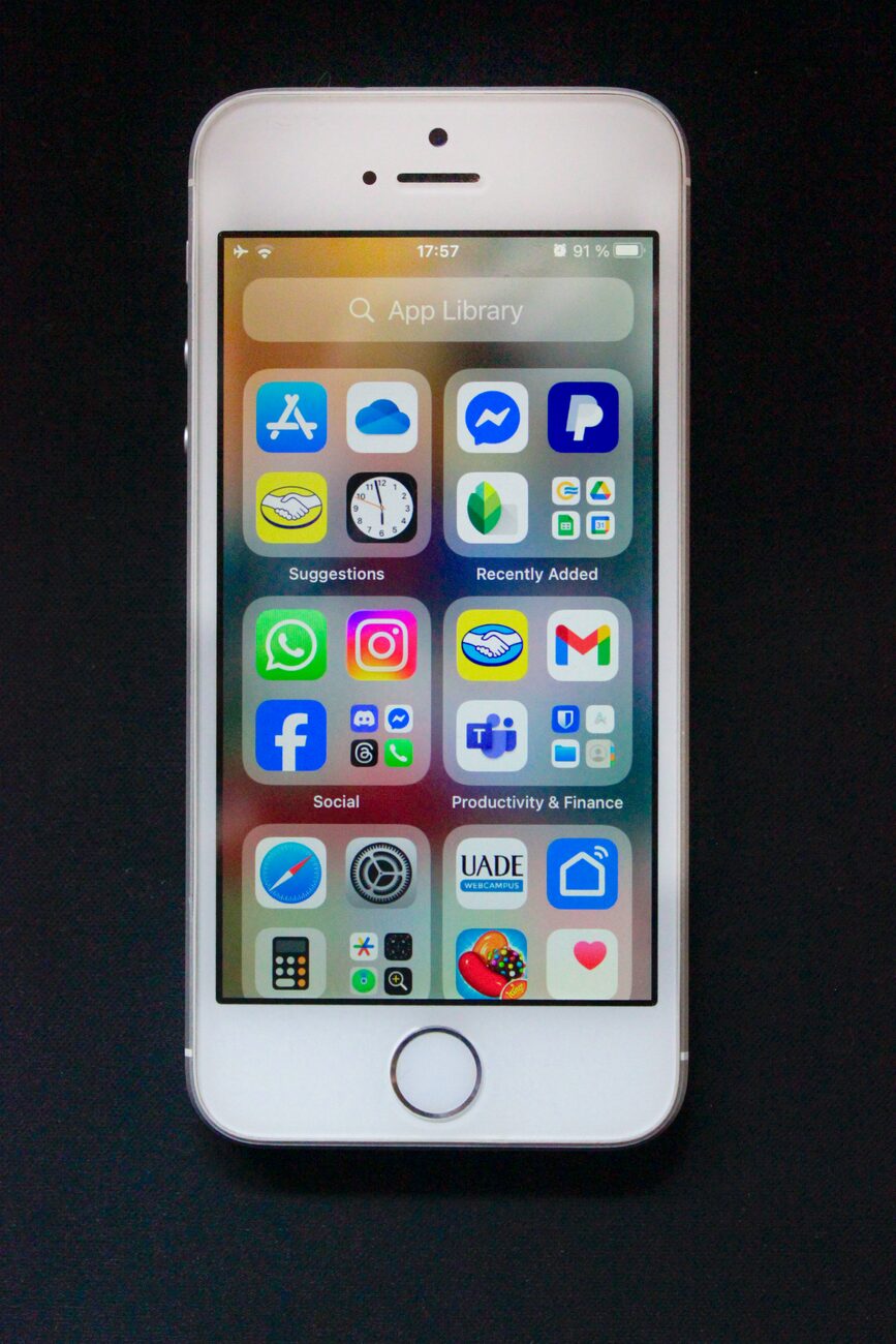 iphone displaying social media and app icons